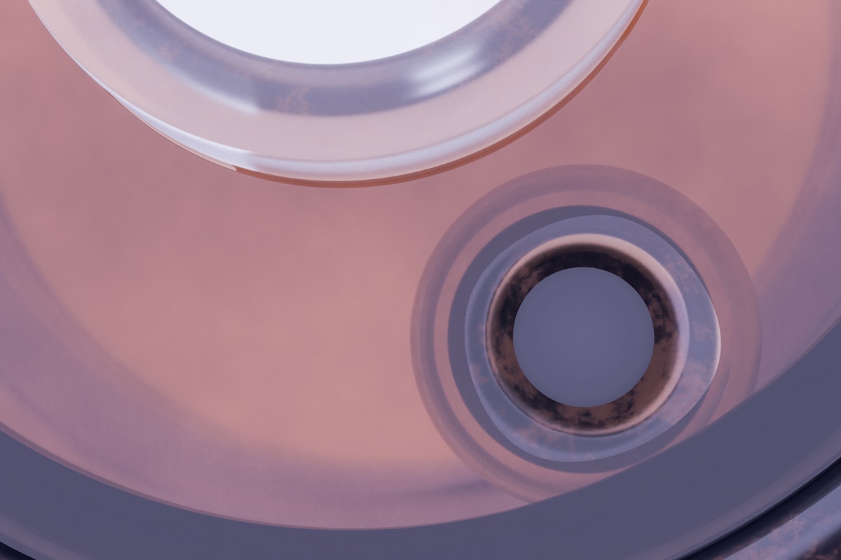 A close up of a metal object with a circular hole